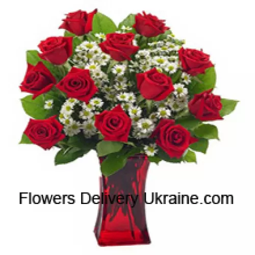 11 Red Roses With Some Ferns In A Glass Vase