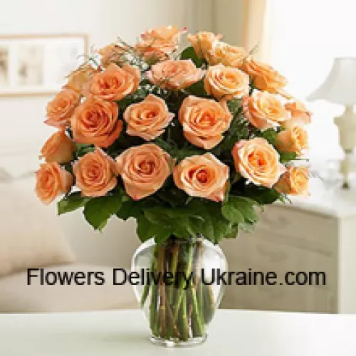 25 Peach Roses With Some Ferns In A Glass Vase