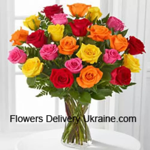 25 Mixed Colored Roses With Seasonal Fillers In A Glass Vase