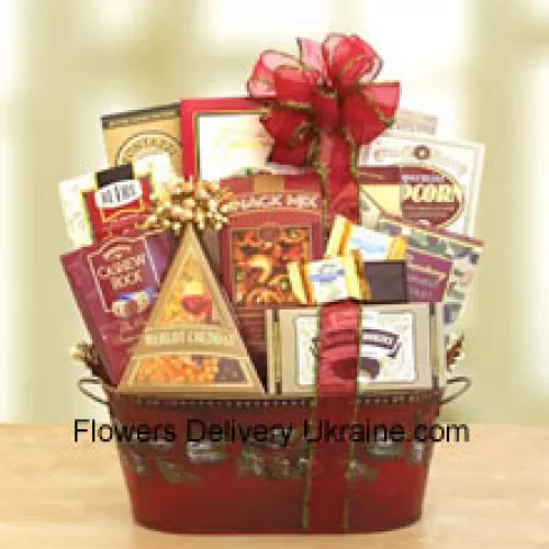 Spread some Christmas cheer to everyone on your holiday gift list this year with our delight gourmet snack basket. This memorable selection arrives in a beautiful pine-cone embossed metal container that is perfect to re-use for many seasons to come. We've packed it with a variety of sweet and savory snacks that anyone will enjoy. Inside they'll be delighted to discover Sonoma cheese straws, chocolate brulee cake, cranberry harvest medley dried fruit, butter-toffee pretzels, Cashew Roca, chocolate chip cookies, merlot cheddar cheese, snack mix, and truffle cookies . It's topped off with a matching red ribbon and delivered straight to their front door or office. (Please Note That We Reserve The Right To Substitute Any Product With A Suitable Product Of Equal Value In Case Of Non-Availability Of A Certain Product)