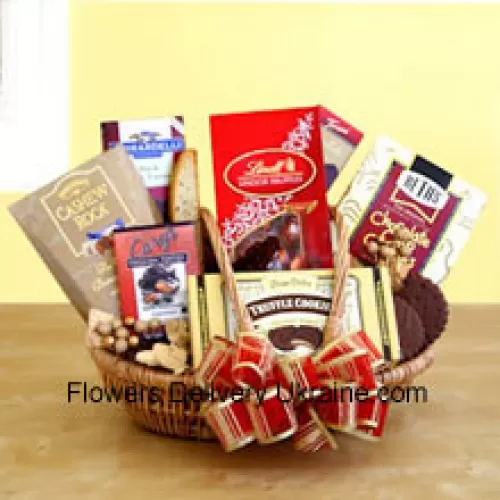 Satisfy their sweet tooth this year with a gift dedicated to chocolate indulgence! Our wicker basket comes brimming with a vast array of gourmet treats, all celebrating the many reasons to love chocolate. Its sweet excess includes Beth's chocolate chip cookies, English toffee, Chocolate truffle cookies, biscotti, Lindt truffles, Cashew Roca and a Ghirardelli chocolate bar. It's one present they'll have a hard time not opening before Father's Day! (Please Note That We Reserve The Right To Substitute Any Product With A Suitable Product Of Equal Value In Case Of Non-Availability Of A Certain Product)